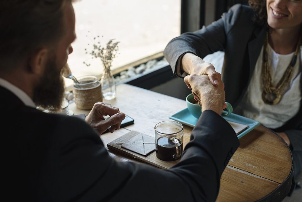 Two business partners shaking hands